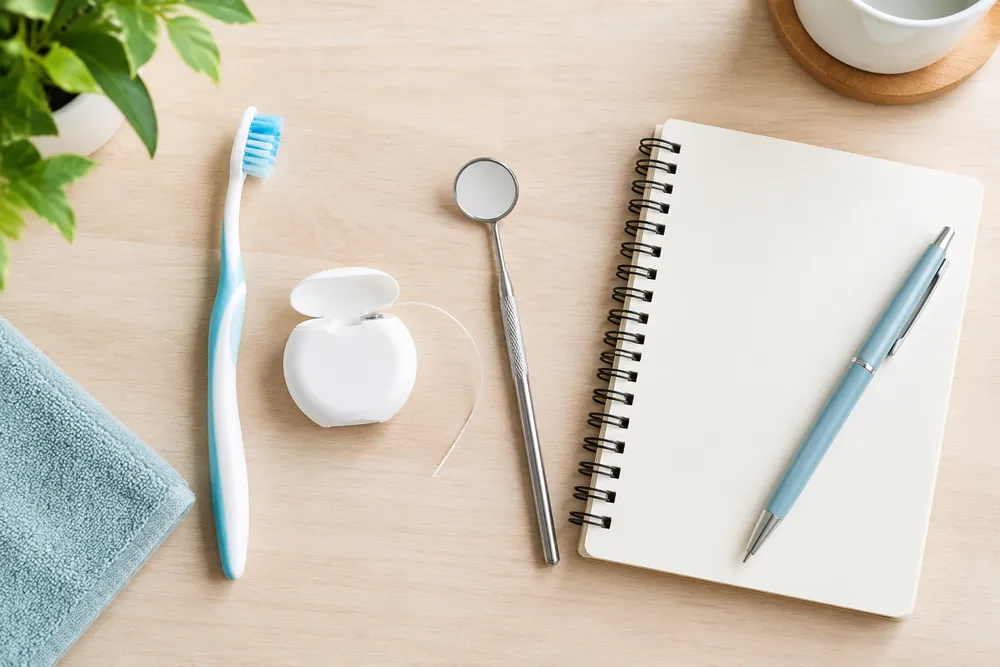 Oral care starter set flat-lay on a light desk